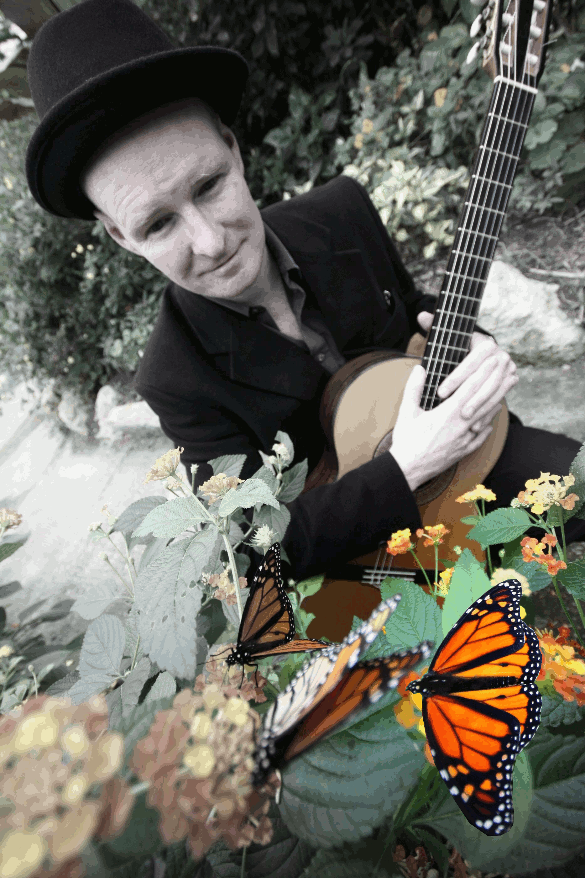 Hughie, with guitar and butterflies